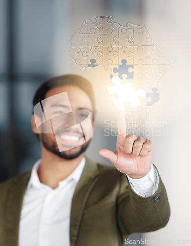 Image of Hologram, puzzle and business man in office for problem solving, solution and Africa, global or innovation. Jigsaw, design and Asian entrepreneur with creative overlay, strategy or futuristic design
