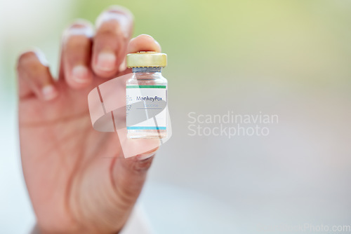 Image of Healthcare, vaccine and hand with monkeypox treatment for cure, breakthrough and innovation on blurred background. Hands, showing and vaccination by woman doctor holding medical booster at hospital