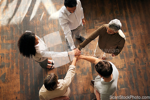 Image of Teamwork, above and people hands stacked for support, collaboration and project mission for business startup. Group circle, women and men, together hand sign and community goals or career solidarity