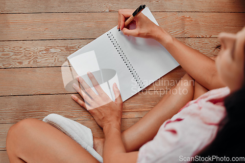 Image of Notebook, writing and planning woman with journal for ideas, inspiration and creativity on wood floor above. Creative young person with mindfulness, healing notes and self care book for writer goals