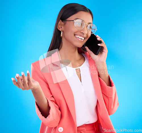 Image of Happy business woman, phone call and communication for deal, consulting or online discussion against blue studio background. Creative female employee talking on smartphone in conversation for startup