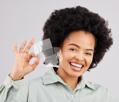 Image of Happy, ok and portrait of a black woman with a sign isolated on a white background in studio. Smile, okay and face of an African girl with a hand gesture for success, agreement and happiness