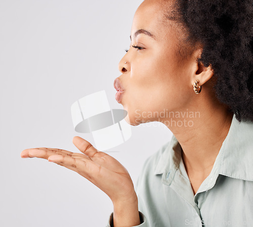 Image of Love, blow kiss and woman profile in a studio with romance, care and happiness. Isolated, white background and young female model with mockup and pout showing loving and mouth kissing gesture