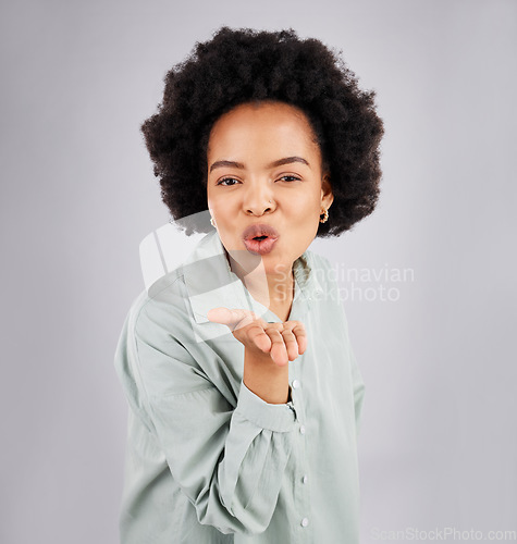 Image of Portrait, woman and blowing kiss in studio, white background and backdrop of love, care or flirt. Face of happy female model, hands and kissing emoji for romance, happiness or smile on valentines day