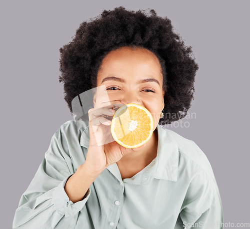 Image of Portrait, orange and black woman with fruit in studio isolated on a white background. Food, top view and happiness of person or female with vitamin c, nutrition or healthy diet, citrus or vegan detox