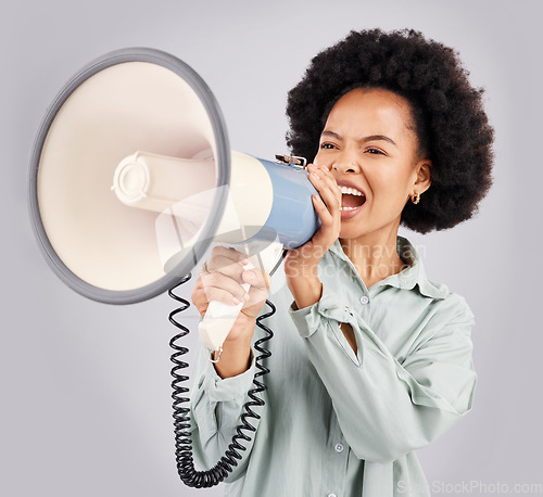 Image of Megaphone, protest and black woman shouting in studio isolated on white background with voice. Screaming, angry and person with loudspeaker for human rights, change or justice, announcement or speech