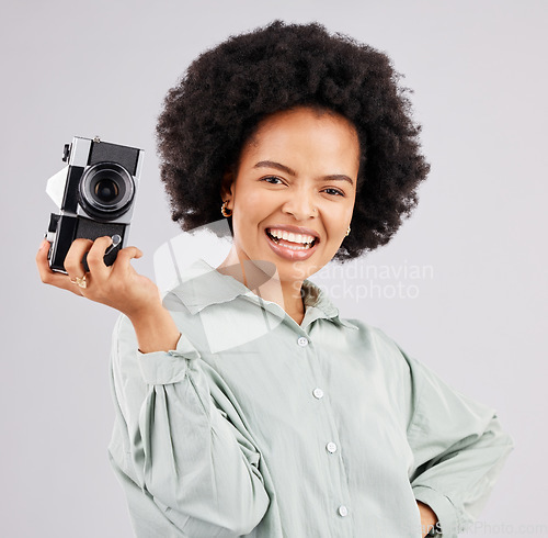 Image of Portrait, camera photographer and black woman smile in studio isolated on a white background. Photography, professional and happy person or female ready to start filming, photoshoot or taking picture