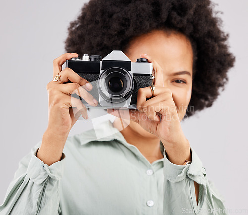 Image of Portrait, camera photographer and black woman in studio isolated on a white background. Photography, professional and person or female ready to start filming, photoshoot or taking paparazzi picture.