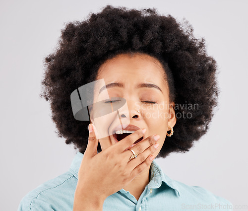 Image of Yawning, studio and face of a woman tired with insomnia and sleep problem. Isolated, white background and fatigue of a young and female model lazy and ready for sleeping and rest covering mouth