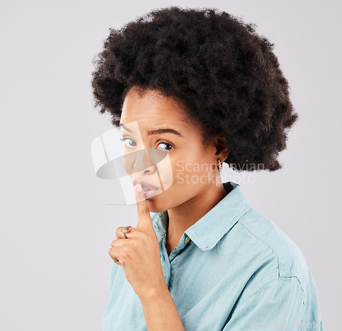 Image of Privacy, portrait and woman with finger on lips in studio, white background and secret sign. Face of female model, silence and shush for quiet, gossip and whisper emoji for confidential, mystery news