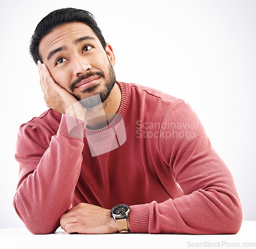 Image of Thinking, man and relax in a studio with looking attractive and handsome at mockup. Isolated, white background or resting male model feeling calm or relaxing with ideas, dreaming or creative thoughts