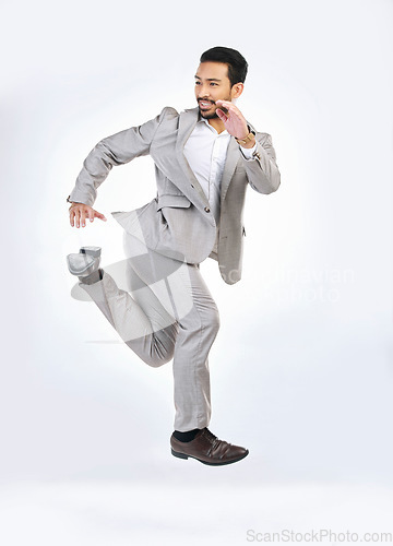 Image of Running, rush and business man late for work jumping, hurry and sprint for appointment in studio. Corporate mockup, time management and Asian male isolated on white background in run to workplace