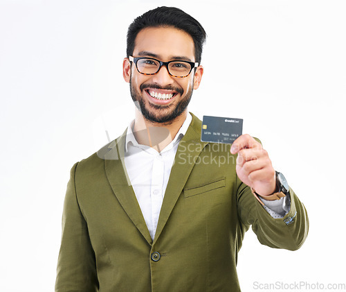 Image of Smile, credit card and portrait of man in studio with happy financial freedom and security savings. Happiness, Indian businessman with banking and saving by investing in small business startup budget