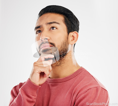 Image of Serious man, thinking face and ideas in studio, white background and vision of mindset, planning and question. Focused male model daydream of decision, remember memory and brainstorming solution