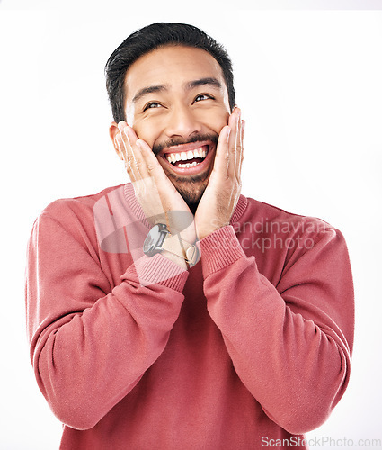 Image of Happy, excited face and Asian man in a studio looking cute and handsome while thinking. Isolated, white background and male model with a cheerful emoji, silly and happiness dreaming about an idea