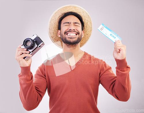 Image of Ticket, camera and excited man in studio with paperwork for holiday, adventure and fun hat on white background. Smile, travel and happy person with boarding pass for vacation, journey and happiness.