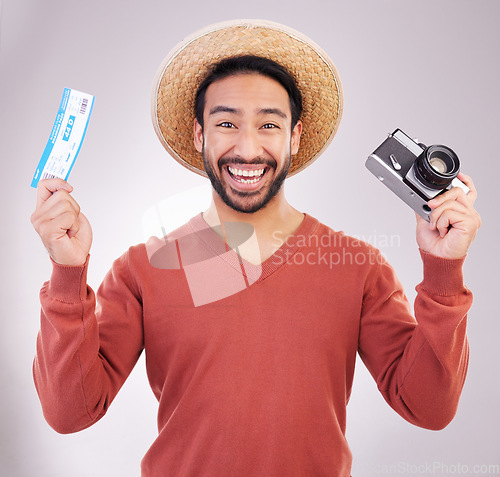 Image of Ticket, camera and portrait of excited man with paperwork for holiday, adventure and fun hat on white background. Smile, travel and happy person with boarding pass for vacation, journey and happiness