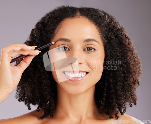 Image of Portrait of woman, beauty and eyebrow pencil in studio for cosmetics, skincare and facial transformation. Happy female model, makeup and drawing shape of brows for aesthetics, happiness or background