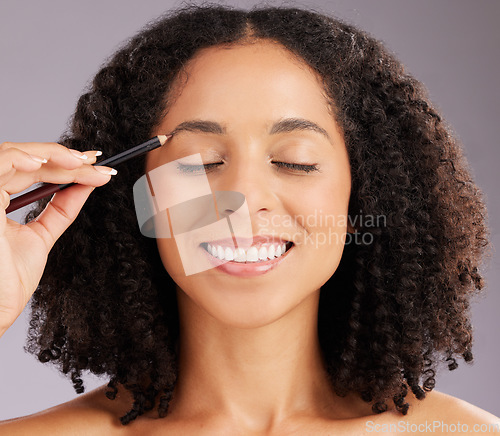 Image of Woman, makeup and eyebrow pencil in studio of face, cosmetics or skincare transformation. Happy female model, beauty and drawing shape of brows of facial aesthetics, happiness and smile on background