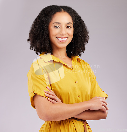 Image of Business woman with smile in portrait, arms crossed and career success with positive mindset on studio background. Happy corporate female, professional and empowerment with pride and confidence