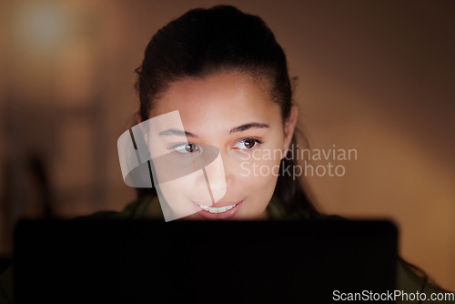 Image of Woman, happy business and laptop at night for planning online strategy, research and company in dark office. Young female worker working overtime on computer for deadlines, productivity or technology