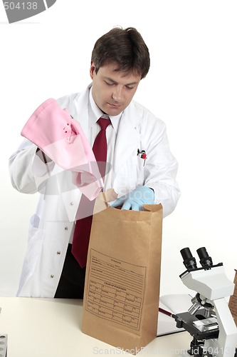 Image of Forensic scientist with evidence