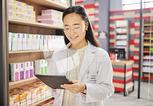 Image of Pharmacist, tablet and Asian woman in pharmacy for healthcare or online consultation in drugstore. Telehealth, technology and happy person or medical professional with touchscreen for shop research.