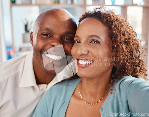 Image of Selfie, happy and portrait of couple in home for bonding, quality time and relax together in living room. Love, relationship and interracial man and woman smile for picture for social media or memory