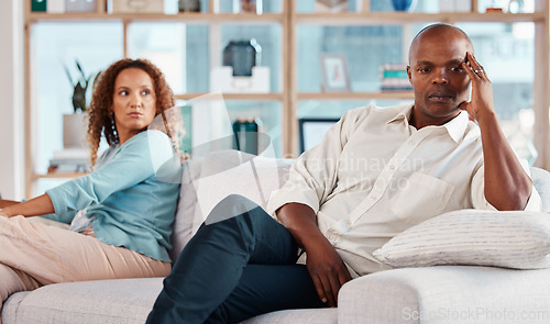 Image of Conflict, fight and couple on sofa for marriage problems, frustrated and depression in living room. Bad communication, relationship and man and woman on couch for fighting, argument and divorce