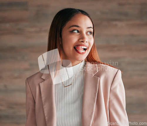 Image of Happy, beautiful and female with her tongue out by a wall with a positive, goofy and confident mindset. Happiness, comic and excited young woman model from Mexico with a silly funny face expression.