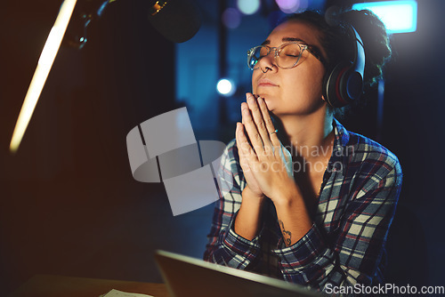 Image of Radio dj, presenter pray and woman in a sound production studio taking praying break at work. Headphones, recording and thinking female employee ready for discussion on air for web podcast and music