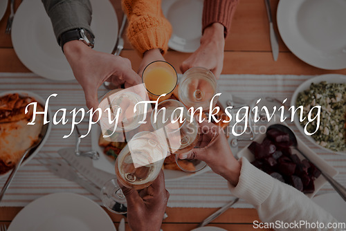 Image of People, hands and cheers for happy thanksgiving dinner, fine dining or celebration above for meal together. Hand of family or friends toasting by table for food, eating or bonding to special occasion