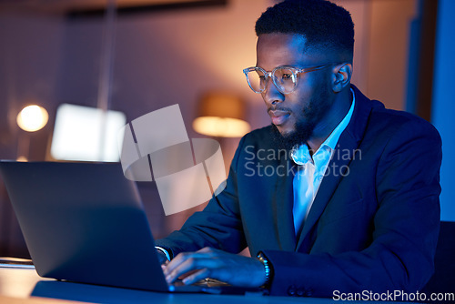 Image of Black man, laptop and typing, businessman focus with coding or writing report, information technology and data analysis. Email, networking and research, programmer and software upgrade at night