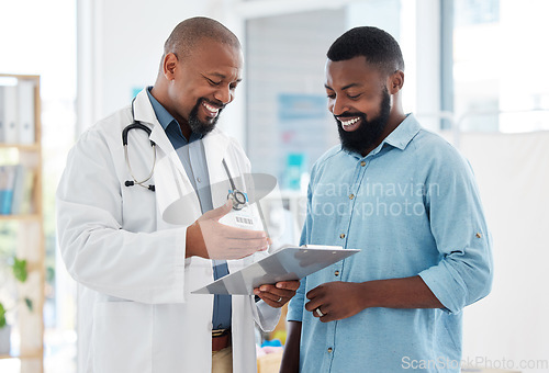 Image of Healthcare, black man and doctor with clipboard, diagnosis and conversation for results, smile and care. Male patient, guy and medical professional with documents, paperwork for insurance and talking