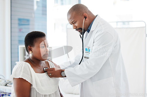 Image of Healthcare, doctor listening to patient heart with stethoscope and medical consultation with black people. Cardiovascular medicine, man with woman in hospital and health insurance with examination