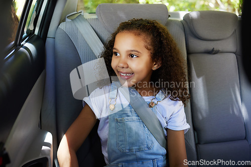 Image of Road trip, girl child and happy in car backseat for travel, journey and drive, happy and relax. Smile, kid and little passenger enjoying drive in vehicle for adventure, vacation or weekend traveling