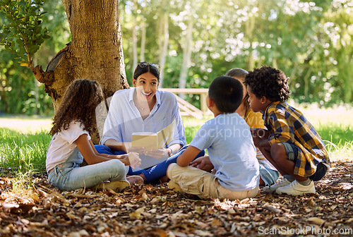 Image of Teacher reading, tree or children with book for learning development, storytelling or growth in park. Smile, youth or happy educator with stories for education at a kids kindergarten school in nature