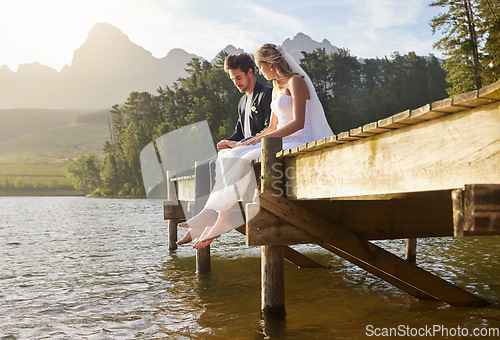 Image of Wedding, lake and couple in nature for marriage ceremony, commitment and trust outdoors. Love, relationship and man and woman bonding on honeymoon for partnership, romantic holiday and celebration