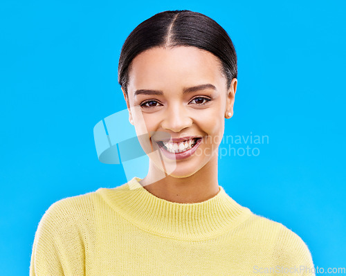 Image of Happy, smile and portrait of woman in studio for relax, beauty and natural makeup. Cosmetics, mindset and happiness with face of female isolated on blue background for glow, cool and satisfaction