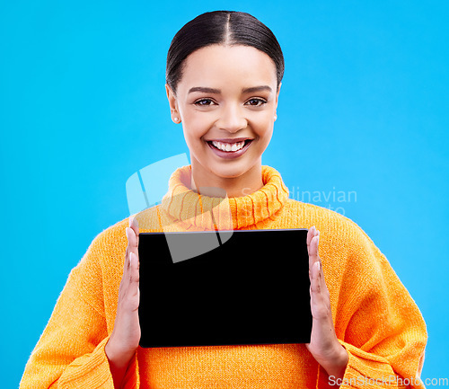 Image of Tablet, mockup and portrait of woman in studio for website, technology and social media news. Networking, internet and connection with female on blue background for app, announcement and search