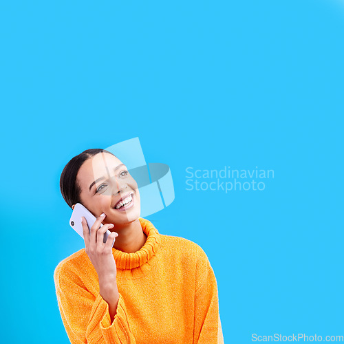 Image of Laugh, mockup and woman on phone in studio with happiness and a smile from talk. Happy, isolated, and blue background and a young female and gen z model laughing on a mobile web conversation