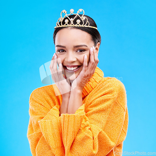Image of Happy, crown and portrait of woman in studio for celebration, princess and party. Smile, beauty and fashion with female and tiara on blue background excited for achievement, winner and prom event