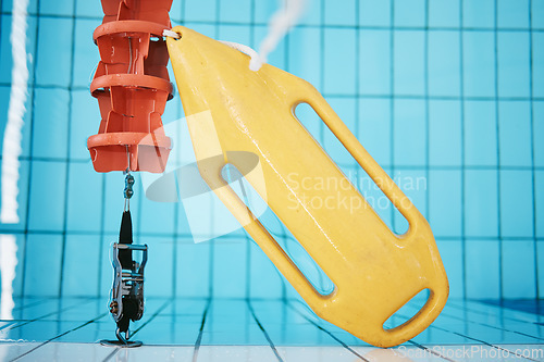 Image of Above, water and a buoy in a pool for a lifeguard, life saving and safety. Board, summer and equipment for protection, security and danger while swimming, rescuing and protecting from drowning