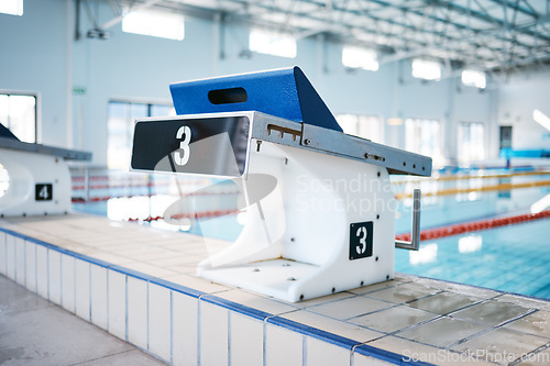 Image of Start, platform and water sports with block at swimming pool for championship, jumping and race. Fitness, competition and wellness with lane in indoor arena for exercise, workout and training