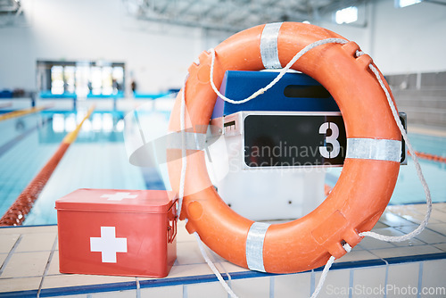 Image of Swimming, equipment and first aid at a pool for security, safety and emergency. Healthcare, guarding and kit for protection, help and support for water activities, sports competition or recreation