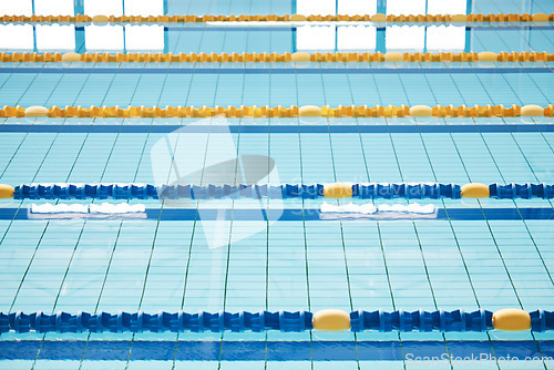 Image of Empty, swimming pool or lines in water for competition or racing lanes for fitness or underwater sports. Background, blue or training arena ready for race performance, workout or exercise challenge