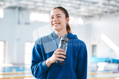 Image of Swimmer, sports of happy woman drinking water to relax after exercise, workout or training on break. Hydrate, athlete fitness or girl smiling with happiness, motivation or liquid bottle for hydration