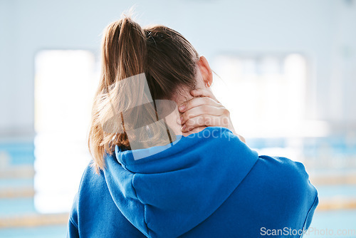 Image of Hands, neck pain and injury at swimming pool after exercise, training or workout accident. Sports, swim athlete and woman with ache, fibromyalgia or tendinitis after exercising or practice.