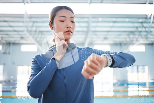 Image of Smart watch, heartbeat and woman at swimming pool for pulse, health or fitness. Sports, swimmer and Asian person check wristwatch to monitor workout performance, exercise progress or training time.