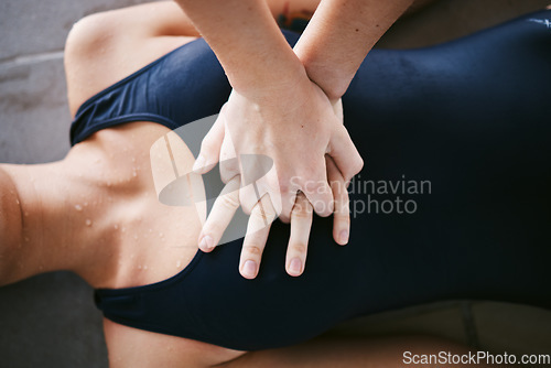 Image of Hands, cpr and first aid with help of lifeguard for emergency, drown or accident after swimming. Sports, breathing and resuscitation of woman, rescue of athlete or saving life of swimmer in top view.